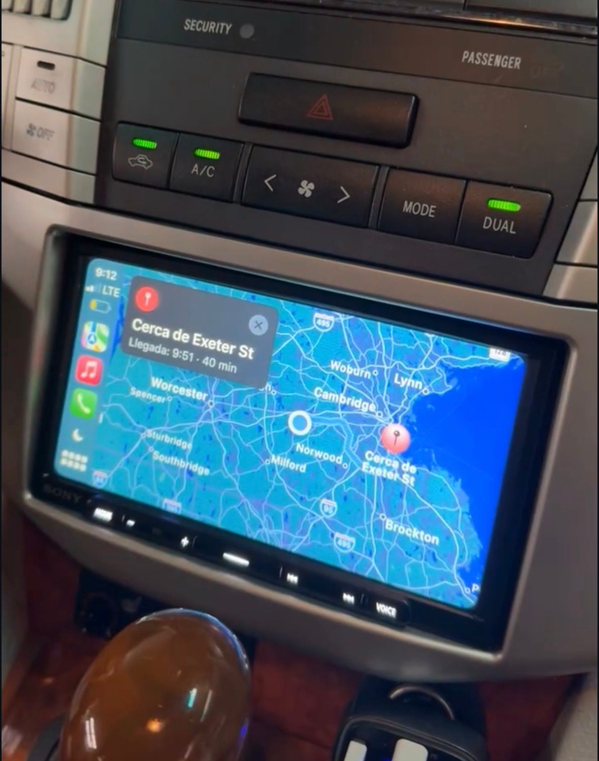 Aftermarket touchscreen head unit running Apple CarPlay with maps