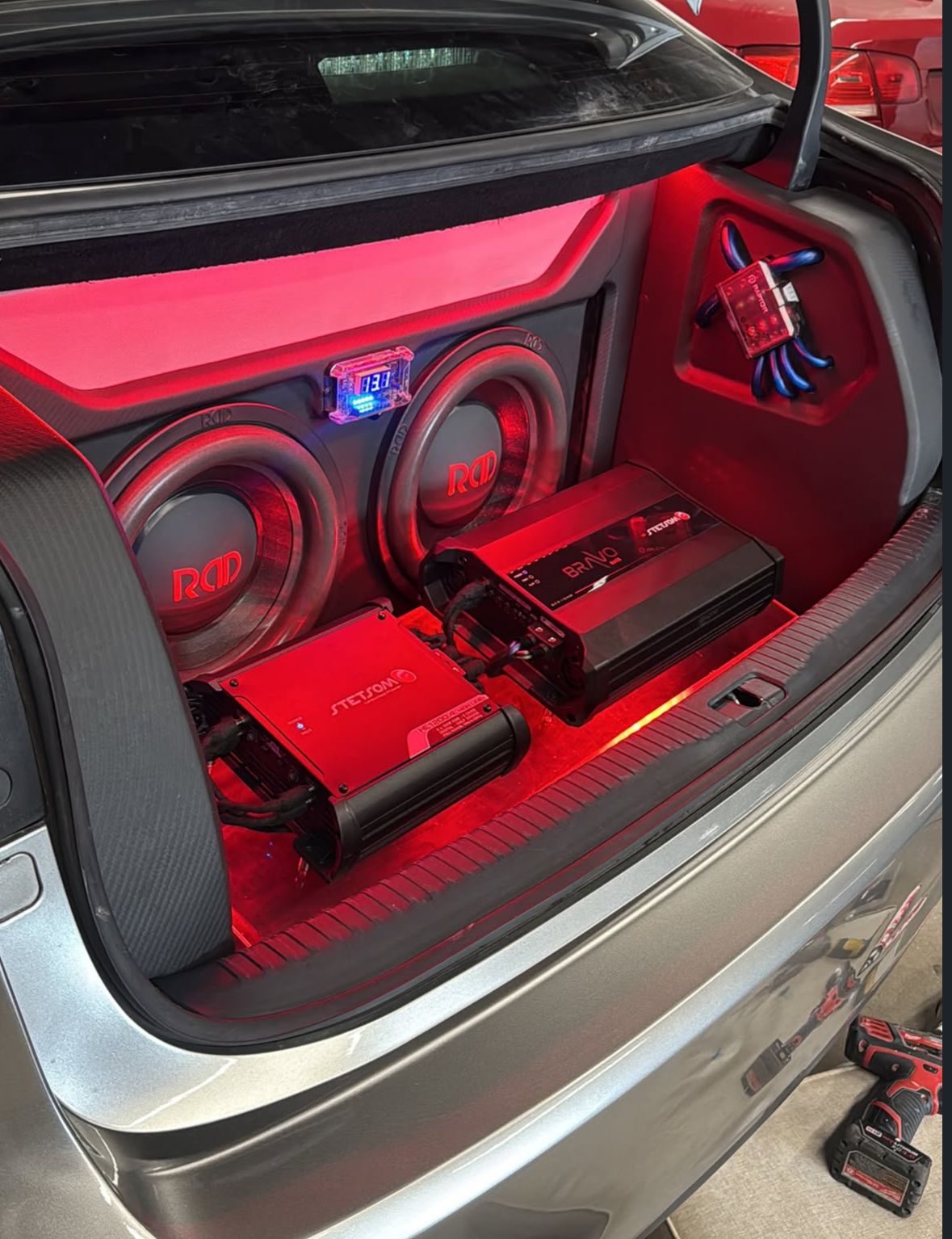 Custom trunk build with dual subwoofers and amplifiers
